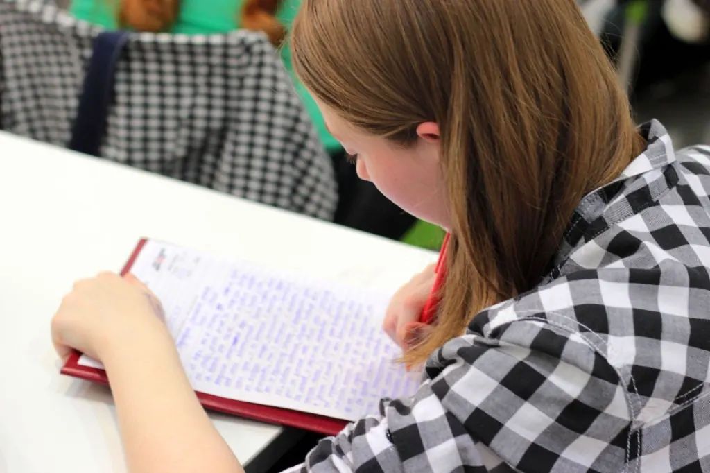 Student filling a test sheet to close a score gap
